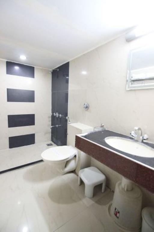 Hotel Eden Ahmedabad Quarto foto